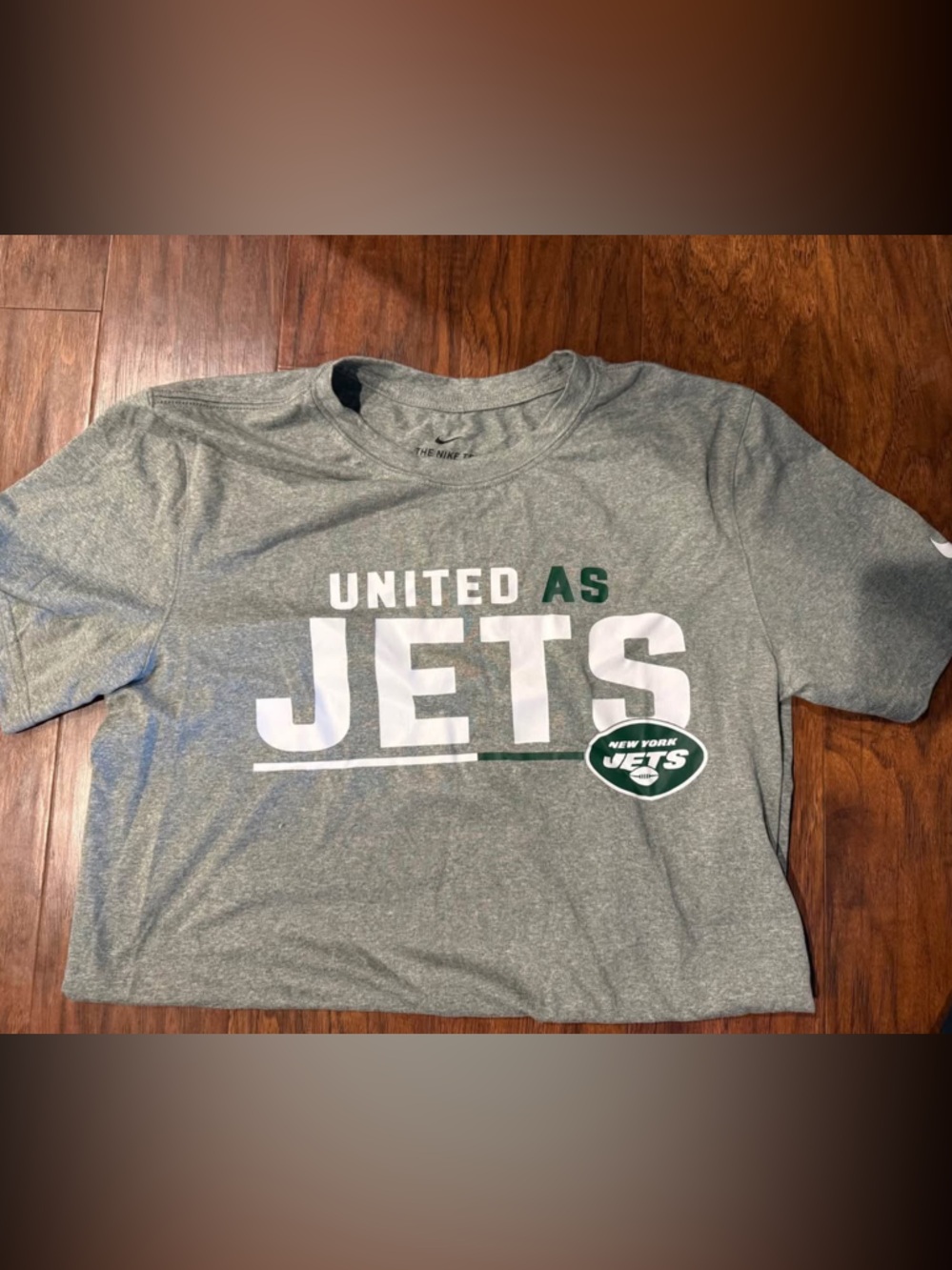 Nike Gray "United As Jets" Short Sleeve Tee with Green and White Logo